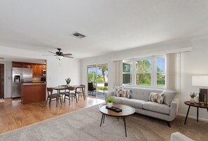 living room and dining area to lanai of unit 1