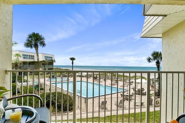 Private Balcony overlooking the pool and beautiful Crescent Beach