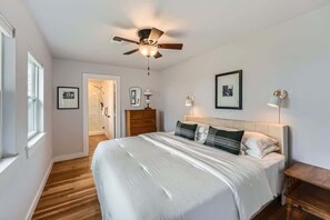 Cozy and inviting bedroom featuring a comfortable mattress and stylish decor.