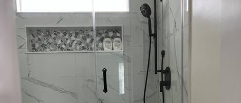 Full size shower with rainfall and adjustable shower head
