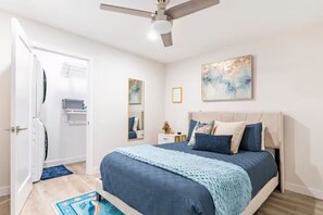 Second bedroom filled with blue and gold notes throughout. 