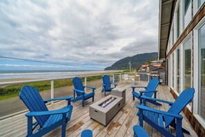 Outdoor firepit and New hot tub, with fenced in hard, and upper deck has wind protected deck with fire table and out door seating