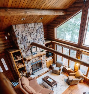 Main living room with wood burning fireplace