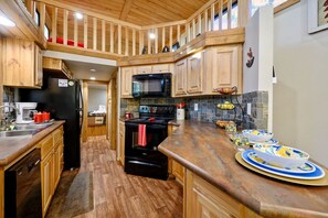 Spacious tiny cabin kitchen with full size appliances