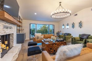 Stylish living room with 65in TV and Hill Country views!