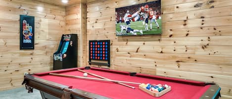Awesome game room with multicade, giant Connect Four, pool table and smart TV.