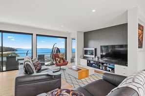 The spacious living area extends to the balcony, offering magnificent ocean views and a flat-screen TV to catch up on your favourite shows. 