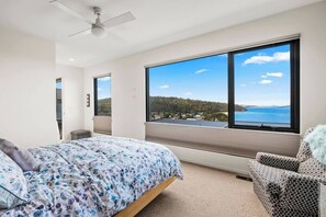  The primary bedroom is upstairs featuring a queen size bed and an ensuite 
