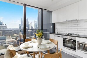 A fully decked kitchen & dining area.