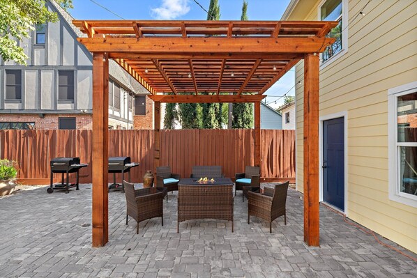 Fire pit, grills, table/chairs. lounge, and cornhole sets.