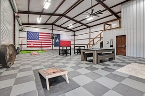 Game area for the young and young-er- Corn hole, pool, basketball, and golfing! 