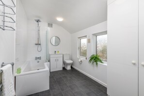 Bathroom with shower and bath