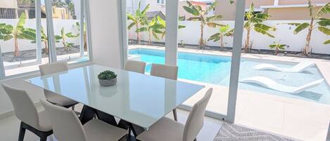 Dining Room Area Opens to the Pool Deck