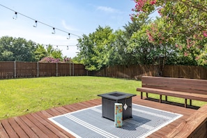 Large backyard with seating and fire pit