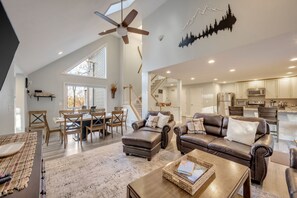 Welcoming open concept living room kitchen and dining room.