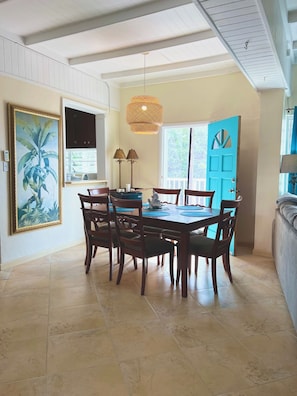 10ft ceilings throughout. Mahogany seating for 6, w/ side door to side porch 