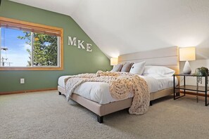 KING bedroom upstairs with 50" smart TV, large closet with shelves, desk, pack n play and play area for kids.