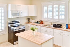 Fully equipped kitchen has everything you may need to prepare a delicious meal.