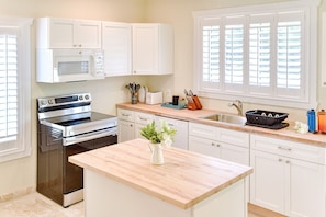 Fully equipped kitchen has everything you may need to prepare a delicious meal.