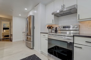 Kitchen entrance and queen bedroom view