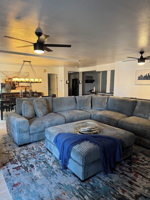 Living room and view of dining room in back.