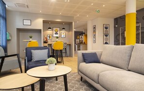 Relax in our comfortable lounge, a perfect spot for leisurely conversations.