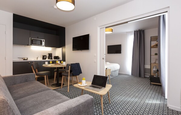Relax and unwind in our inviting living area, designed for utmost comfort and enjoyment.