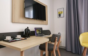 Stay productive on vacation with our in-suite desk, perfect for any remote work needs.