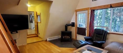 Our lovely living room! Lofted ceilings & nice natural light