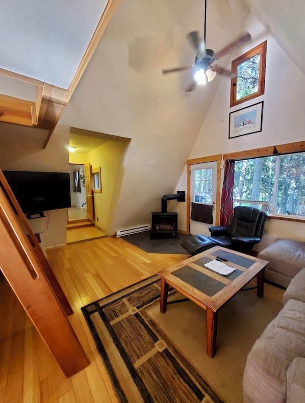 Our lovely living room! Lofted ceilings & nice natural light