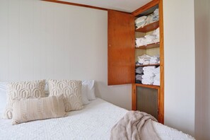 Extra towels and sheets can be found in this built-in linen cabinet in the master bedroom