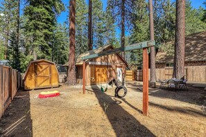 Soak up the sunshine in the fenced backyard where you can relax at the patio table while the kids enjoy the swingset.