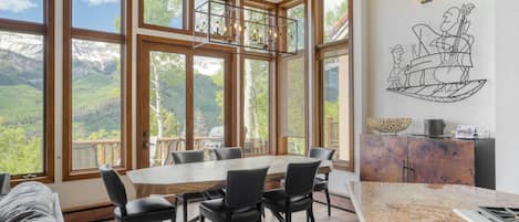 Beautiful dining area with floor-to-ceiling windows and views.