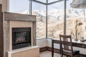 Workspace with a second fireplace and huge windows.