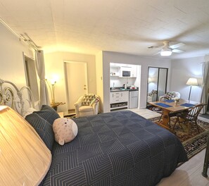 This apartment has a kitchenette, table, desk and two reading nooks. 