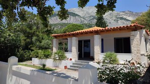 Villa with the cliffs of Mt Kerkis 1km behind