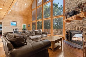 Living Room - Floor-to-Ceiling Window with Mountain View and a Fireplace - First Floor