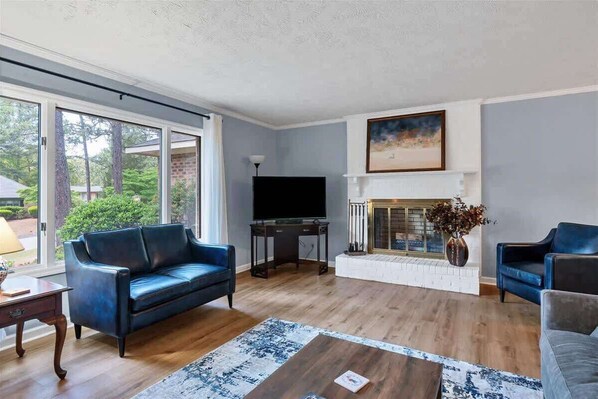 Cozy living room with a real wood burning fireplace