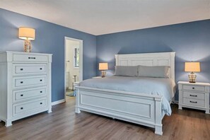 Clean and comfortable primary bedroom with a king bed