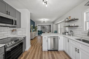 Open Concept Living connecting the Kitchen - Dinning Room - Living Room