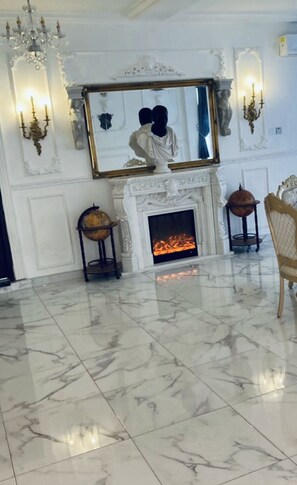 French fireplace with marble bust of noble Roman Nubian atop: Peacock Mansion