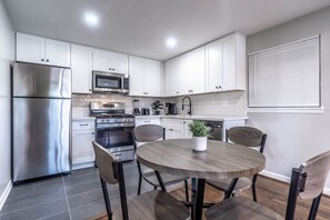stainless steel appliances and a 4-seater dining area combine style and comfor