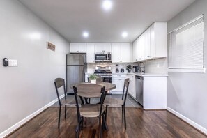 stainless steel appliances and a 4-seater dining area combine style and comfor