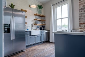 This gorgeous kitchen provides a comfortable space for you to prepare your meals