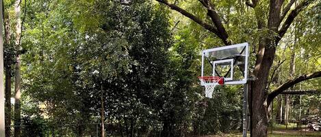 Shoot basketball with family and friends behind the house