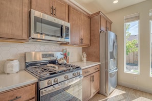 Stylish countertops and top-tier appliances make meal prep a breeze.