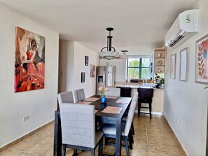 Dining table can expand to be longer and sit 8 in full chairs and 2 in folding.