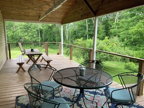 large deck for relaxing and eating. not pictured, a hammock