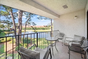 Balcony overlooks a tranquil pond