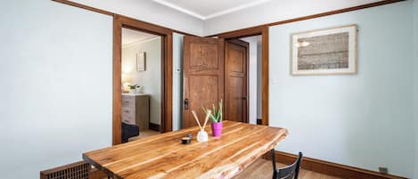 Spacious dining room with a unique wooden table! 